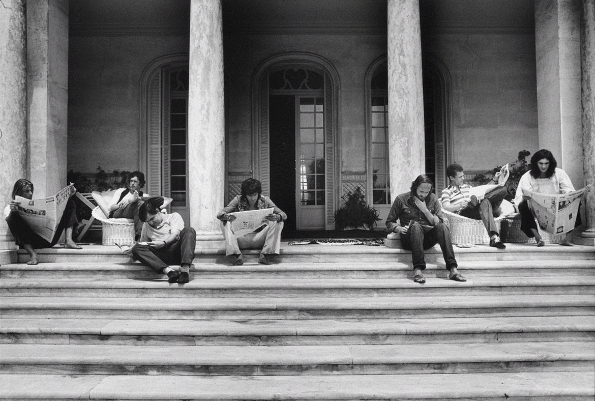 The Rolling Stones Reading Newspapers on the Steps, Nellcôte, France, 1971