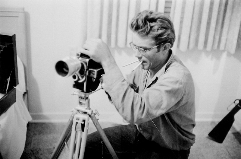 James Dean Working with Camera in Hotel Room While Making Giant, TX, 1955