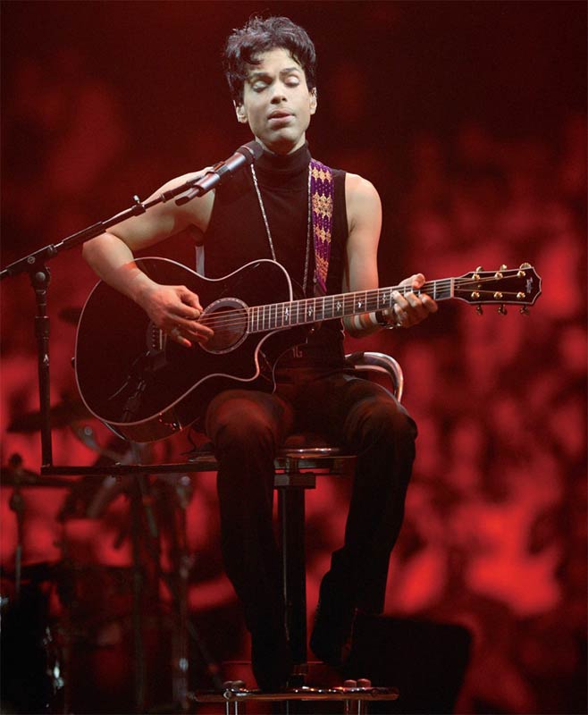 Prince Onstage Seated Playing Acoustic Guitar, Musicology Tour, 2004