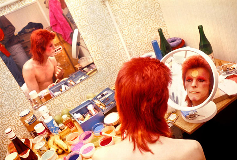 David Bowie Applying Makeup in a Circular Mirror, Scotland, May, 1973