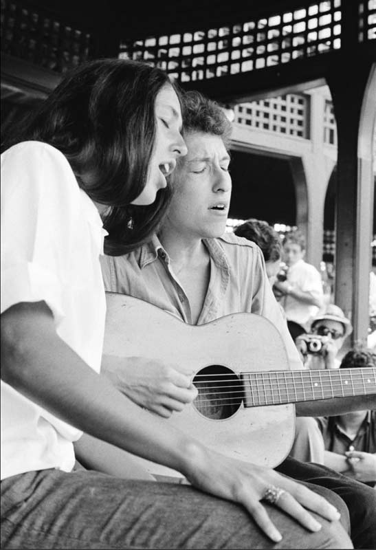 Joan Baez and Bob Dylan Singing (seated portrait), Newport Folk Festival, 1963