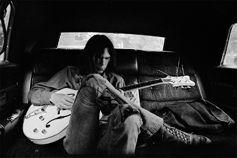 Neil Young in Limo with White Falcon Guitar, NYC, 1970
