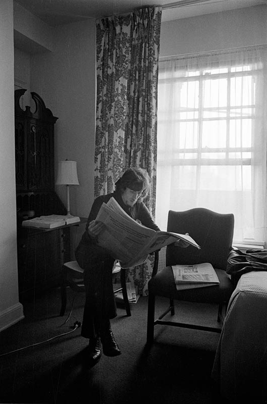 Graham Nash Reading a Newspaper, NYC, 1970