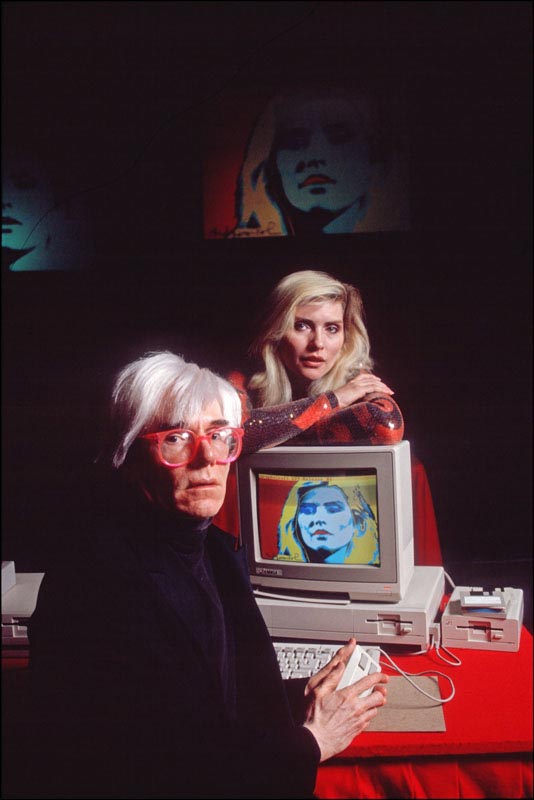 Andy Warhol with Debbie Harry and his Amiga Computer Portrait of Harry, NYC, 1985