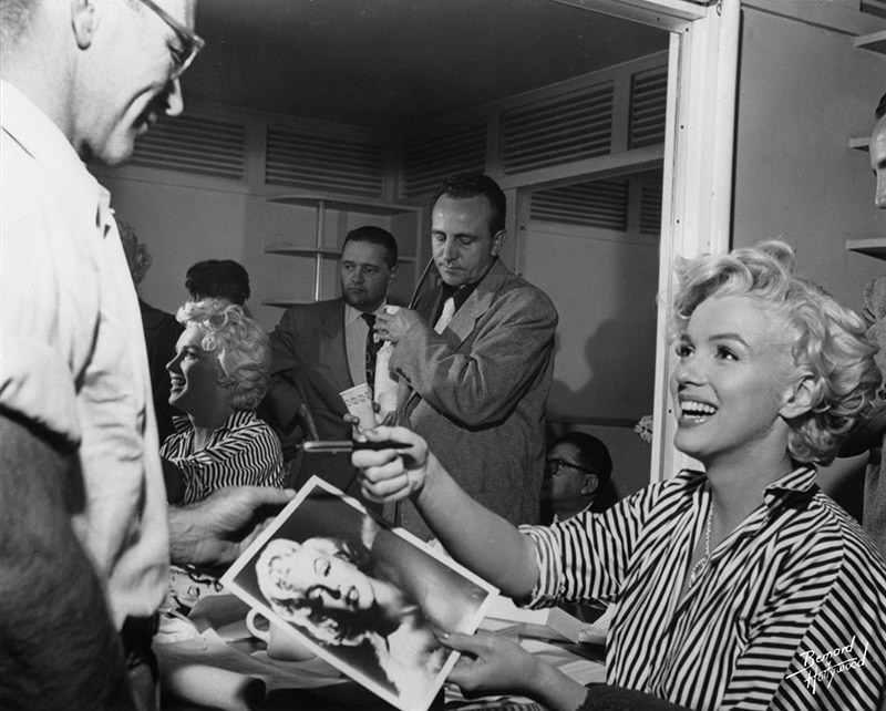Marilyn Monroe, Signing Autographs in her Dressing Room, 1954
